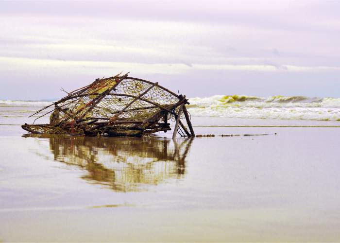 fishing boat at sea with a large net